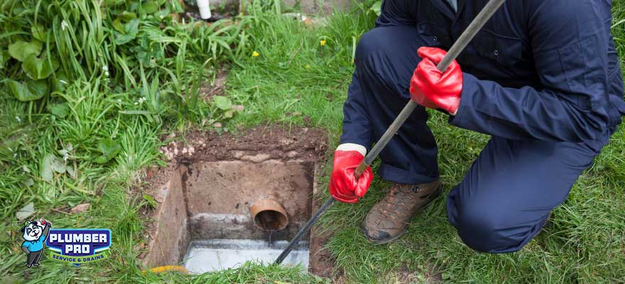 Licensed technician performing a catch basin repair in Gwinnett County, GA.