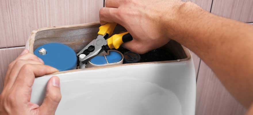 A Gwinnett Plumber Pro technician providing emergency toilet repair service in Lawrenceville, GA, ensuring quick and professional repairs.