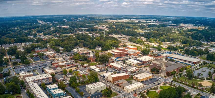 Aerial view of downtown Lawrenceville, GA, featuring the Gwinnett Historic Courthouse and local shops