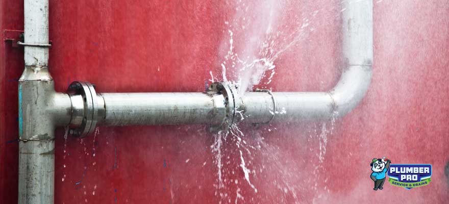 Emergency plumber fixing a burst pipe in Norcross, GA