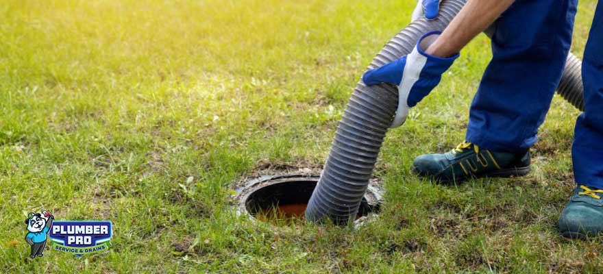 A Gwinnett Plumber Pro technician performing septic tank pumping services in Lawrenceville, GA.